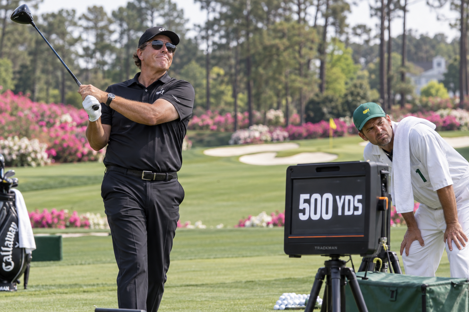 Phil Mickelson inspects a 500-yard reading at the practice range.