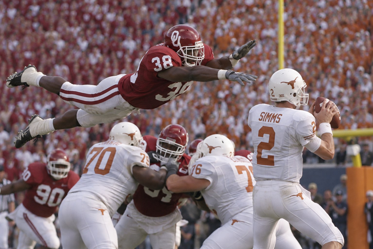 The Superman moment revisited: Oklahoma’s No. 38 takes flight toward Texas quarterback Chris Simms.